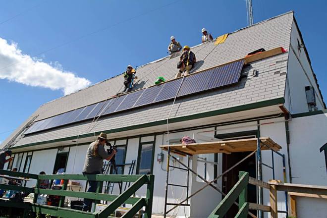 Students expanded the KILI Radio station's solar PV array, creating more clean energy sources on Pine Ridge. (Photo credit: Boots Kennedye)